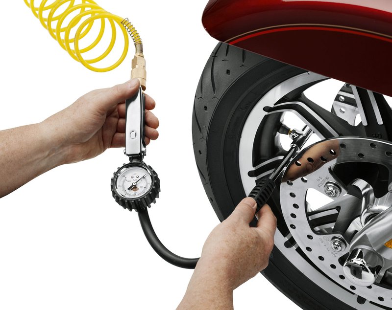 Harley-Davidson Accessories Simplify checking the air pressure and filling the tires on your motorcycle. This tire pressure gauge features an 18" flexible hose and a 2-way air chuck with both a 45-degree fill port and a unique side fill port that gives easy straight-in access to hard-to-reach valve stems. Lets you check pressure and add air without removing the chuck: just apply it to the valve stem, read the pressure, and add air by depressing the comfortable trigger lever. On the road it works like any standard tire gauge. Designed to fit an air compressor with a standard 1/4" quick-disconnect coupler. Dual-range instant-read gauge measures 0-60 psi and 0-400 kPa, and is protected from impact and abrasion by a thick rubber collar.