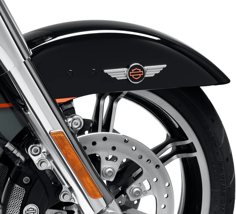 Harley-Davidson Accessories Display a touch of attitude with the Chrome Winged Bar & Shield Decorative Medallion. Ideal for application on a plate-style sissy bar upright, derby cover, timer cover, Tour-Pak luggage carrier or saddlebag, glove box or chrome battery cover. It also looks great on a tool box or tailgate. The quality adhesive backing on this premium zinc die cast medallion allows for easy and secure installation on most flat surfaces. Brilliant chrome wings flank a centred black and orange Bar & Shield logo. Measures 4-7/8" x 1-1/2". Self-adhesive and easy to install.