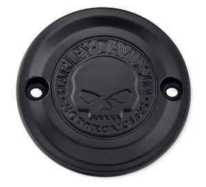 Harley-Davidson Accessories Willie G Skull Timer Cover in black. Penned at the hand of Willie G®, the famous Skull Collection makes a shift to the dark side. Completely drenched in black, the raised skull and surrounding Harley-Davidson® Motorcycle script add a subtle ominous touch to your ride. The matte finish easily coexists alongside gloss black or wrinkle black surfaces. Includes matching black hardware. Complete the look with additional accessories from the Harley-Davidson Willie G Skull Collection.