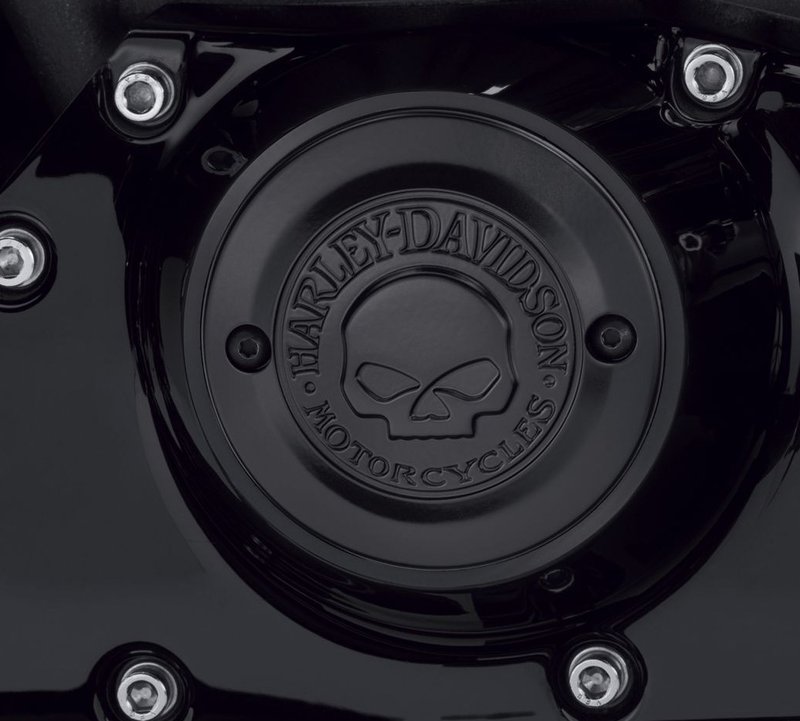 Harley-Davidson Accessories Willie G Skull Timer Cover in black. Penned at the hand of Willie G, the famous Skull Collection makes a shift to the dark side. Completely drenched in black, the raised skull and surrounding Harley-Davidson Motorcycle script add a subtle ominous touch to your ride. The matte finish easily coexists alongside gloss black or wrinkle black surfaces. Includes matching black hardware. Complete the look with additional accessories from the Harley-Davidson Willie G Skull Collection.