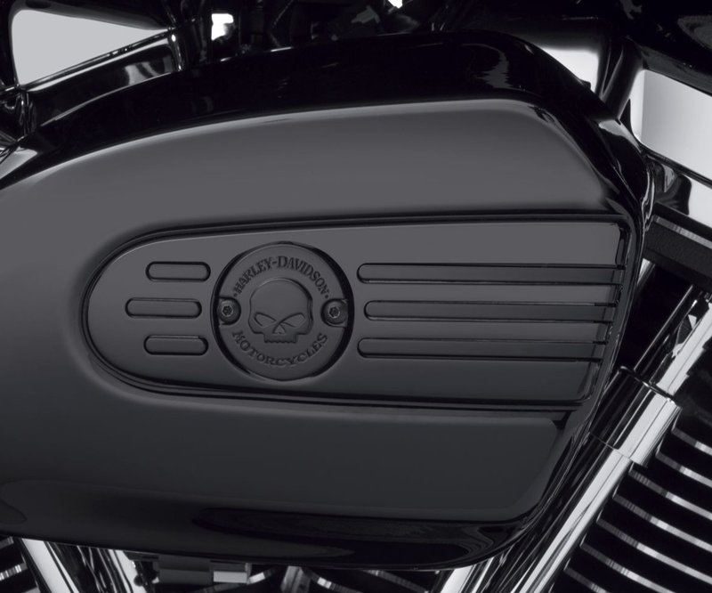 Harley-Davidson Accessories Willie G Skull Air Cleaner Trim in black. Penned at the hand of Willie G®, the famous Skull Collection makes a shift to the dark side. Completely drenched in black, the raised skull and surrounding Harley-Davidson® Motorcycle script add a subtle ominous touch to your ride. The matte finish easily coexists alongside gloss black or wrinkle black surfaces. Includes matching black hardware. Complete the look with additional accessories from the Harley-Davidson Willie G Skull Collection.
