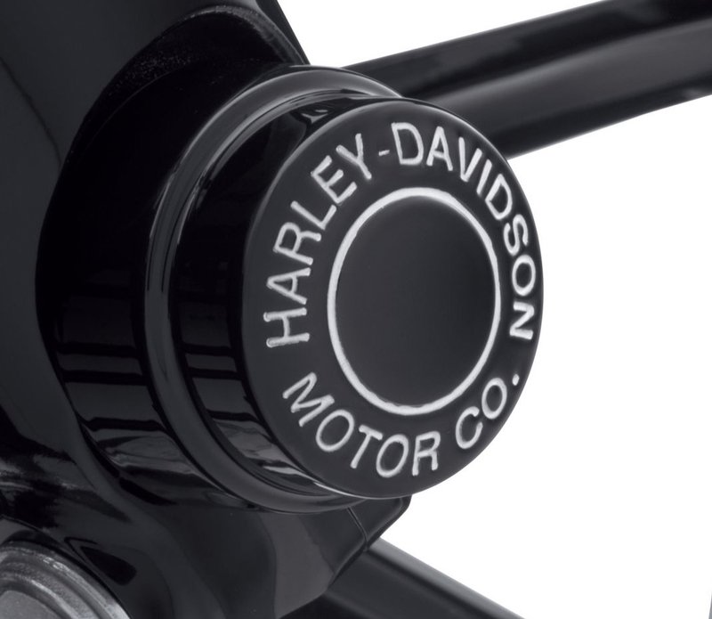 Harley-Davidson Accessories Cover the front axle in style. Drenched in gloss black and trimmed with deep-cut, silver-filled Harley-Davidson® Motor Co. lettering, these Front Axle Nut Covers are an aggressive twist on a classic style. Gloss black finish. Looks great with original-equipment satin-finish fork sliders, or the perfect finishing touch to complete a blacked-out front end. Includes set screws and Allen wrench for easy installation. Sold in pairs.