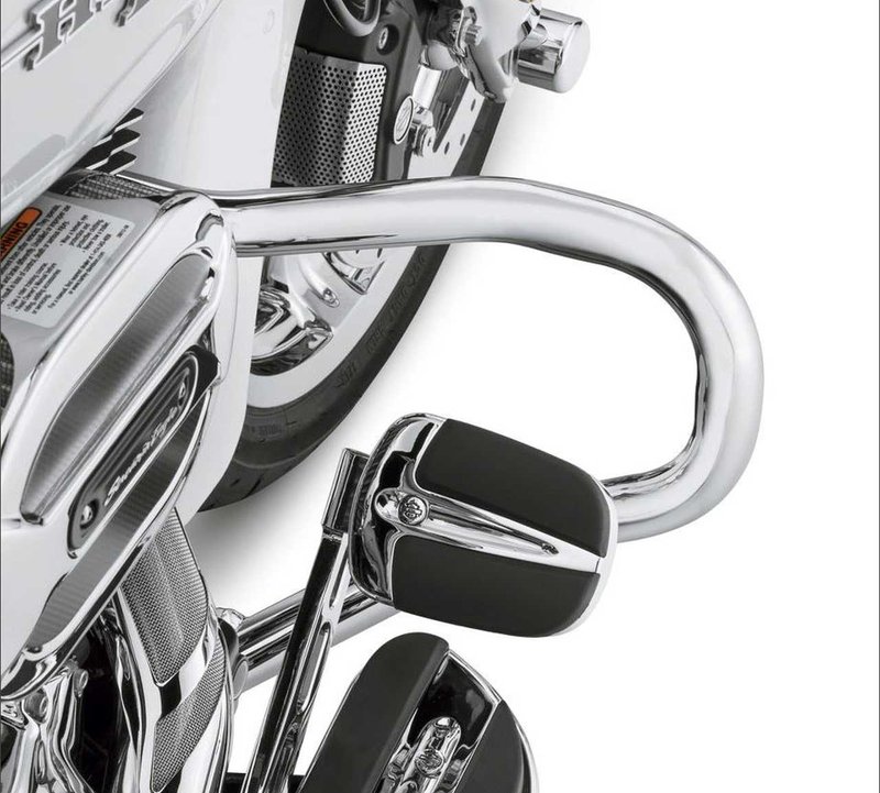 Harley-Davidson Accessories Create a sleek, slammed look on your custom bagger with the Chopped Engine Guard. This guard offers a slim, low-profile design that retains function while delivering a unique styling twist. - Chrome finish - Upper mounts connect midway up the downtube, 11" lower than the stock guard - The minimalistic look reduces the visual mass of the bike, while the mounting point lowers the bike's visual centre of gravity by 1.25" - The engine guard features a slightly forward sweep that provides plenty of room around the brake and shift levers - Easy to install