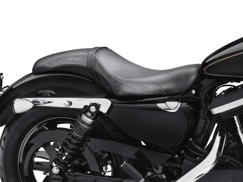 Harley-Davidson Accessories It's good to be bad. The low and lean Badlander Custom Seat is designed to fit your bike like a glove. It delivers low-slung cruiser style from the fuel tank to the rear fender, giving you the feeling of sitting "in" the bike rather than on top of it. - Rich textured vinyl seating surfaces for durability - Charcoal black leather side panels and dark grey stitching - Harley-Davidson embroidered script for style - The narrow nose of the seat is sculpted to complement any size of Sportster fuel tank - Seat width 11.5", passenger pillion width 5.5"