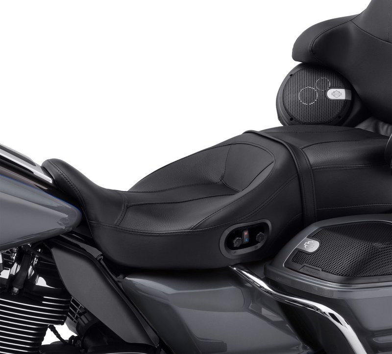 Harley-Davidson Accessories Extend and optimise your riding season thanks to the cooling and heating technology built into this premium seat for Touring and Trike models. The electronic heating/cooling system is self-contained within the seat, which can be easily removed after unplugging a single cord. It offers industry-leading cooling performance, and the heating function reaches its selected temperature twice as fast as previous heated seats. The Hammock seat is the most premium touring seat design, created for the rider who wants the ultimate in long-haul comfort. It features a sling-like fabric suspension system that acts like a hammock, providing two inches of suspension above the seat pan, topped with an additional two inches of traditional foam cushioning. This internal suspension prevents bottoming out and improves comfort and endurance by isolating the rider from harsh road conditions. The passenger position features a multiple spring-board style suspension system along with two inches of traditional foam. - In testing with a baseline ambient temperature of 85 degrees, the seat cover cools down by 25 degrees in about 30 minutes, from a 98-degree body temperature to about 76 degrees - As you ride, the cooling function draws heat away from your body to make you feel cooler - Dual-zone control: rider and passenger positions must use the same temperature mode (heat or cool), but each can adjust the level to individual preference or switch the function off - The redesigned heating element reaches the selected temperature in only seven minutes - Seam-sealed construction prevents rain or wash water from infiltrating the seat foam - Compatible with the Rider Backrest Mounting Kit (P/N 52589-09A for Touring models and P/N 52300642 for Tri Glide models)