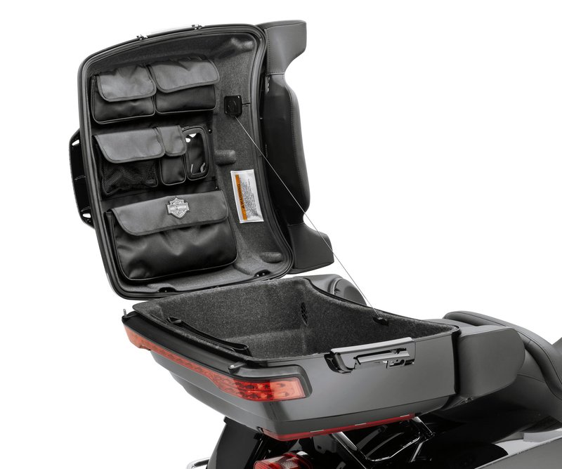 Harley-Davidson Accessories Tour-Pak Lid Fitted Lining with Organizer, gray. This lid lining features a convenient six-pocket organiser to keep smaller items at hand, and is shaped to fit the contours of the Tour-Pak lid for a finished look. The organiser includes four enclosed pouches, one mesh pouch and one clear mobile-device pouch. Hook-and-loop fasteners allow easy removal for cleaning, and the soft gray finish is a perfect match for the Original Equipment Tour-Pak bottom liner. Fits '14-later FLHTCU, FLHTK, FLHTCUTG and models equipped with King or Chopped Tour-Pak luggage.