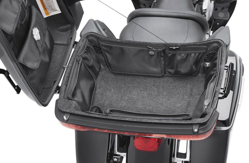 Harley-Davidson Accessories Tour-Pak Wall Organizer. This convenient storage net wraps the interior walls of your King Tour-Pak for easy access to keys, phones, maps and gloves. It features three large nylon mesh pockets with hook-and-loop closures, two elastic pouches and two open pouches for easy access, and installs easily with the included hook-and-loop tabs. Fits '14-later Touring and Tri Glide models (except CVO) equipped with King Tour-Pak luggage.