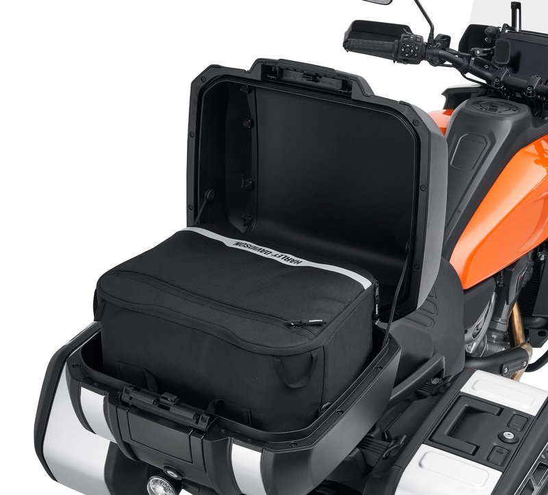 Harley-Davidson Accessories Simplify packing and unpacking your motorcycle. This water-resistant liner is designed to fit perfectly into the Sport Top Case. Styled with a Bar & Shield logo, it features heavy-duty zips, comfortable carrying handles and convenient D-rings for optional shoulder straps. - Carrying handles have an integrated hook-and-loop patch to keep them together - Shoulder strap allows easy hands-free transport