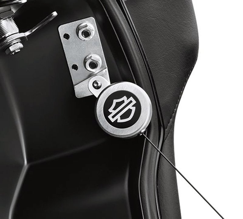 Harley-Davidson Accessories Retractable Tour-Pak Lid Tether. Add the convenience of a retractable tether to your Tour-Pak. When extended to its full length, the strong cord holds the lid open at least 10 degrees past vertical for improved stability and easy packing, then automatically coils the cord inside the housing to prevent pinched cords when closing the lid. The attractive housing with Bar & Shield logo attaches to the existing mounting points and replaces the Original Equipment cord. Fits Touring '97-'13 models equipped with King, Ultra, Chopped or Razor-Pak Tour-Pak luggage.