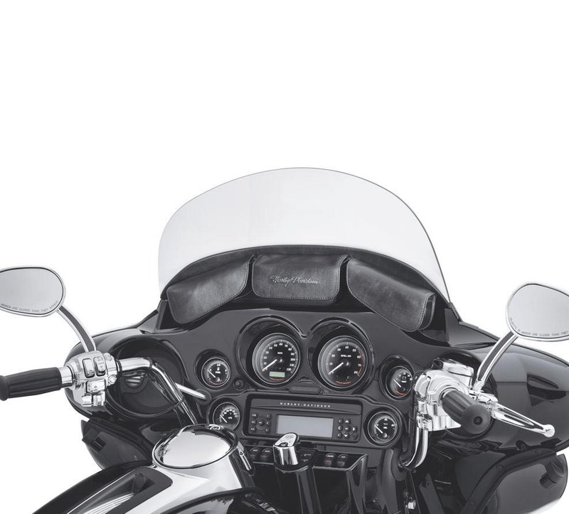 Harley-Davidson Accessories Three-Pocket Fairing Pouch. Convenient storage space at your fingertips. Designed to complement H-D wind deflectors and windshields, this fairing pouch is ideal for storing phones, sunglasses and other small items. The sturdy plastic pouches are wrapped in supple UV-resistant vinyl for a premium look and feel, and magnetic closures keep your items within reach without detracting from the smooth styling. The left-hand pouch can be removed to accommodate a fairing-mounted GPS unit, and a "Harley-Davidson" script appears on the front centre pouch and the outboard side, visible through the windshield. Fits '96-'13 Electra Glide and Street Glide models.