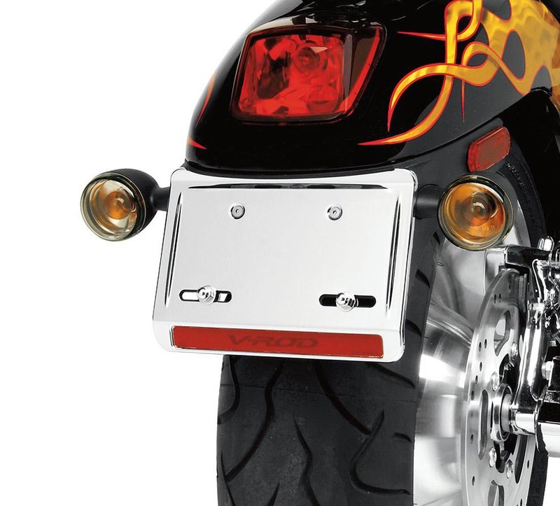 Harley-Davidson Accessories Show off your tail. This chrome-plated cover fits over the stock fender-mount licence plate bracket. The mirror-finished cover features a custom reflector with graphics. Includes mounting hardware for the cover and licence plate.
