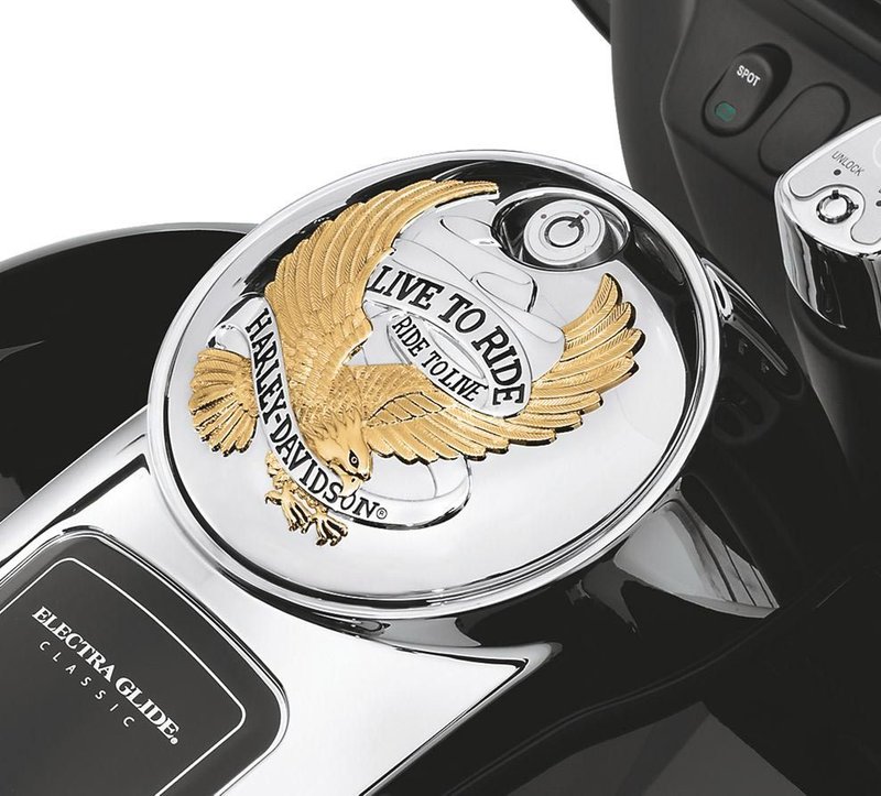 Harley-Davidson Accessories "Live to Ride, Ride to Live." It has become the motto of the Harley-Davidson nation, accompanying riders over millions of miles of travel, and this collection is a tribute to that way of life. This easy-to-install fuel door replaces the stock door and reuses the original equipment mounting hardware and lock. Gold finish.