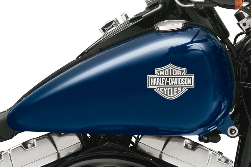 Harley-Davidson Accessories Original Harley-Davidson Tank Medallions are high-quality emblems for decorating the fuel tank. They are shaped to suit the tank of the respective original model and are usually self-adhesive for easy mounting. Sold each (see below for the other side). For the left side. Original quality with excellent durability. Size: 9.5 x 7.5 cm.