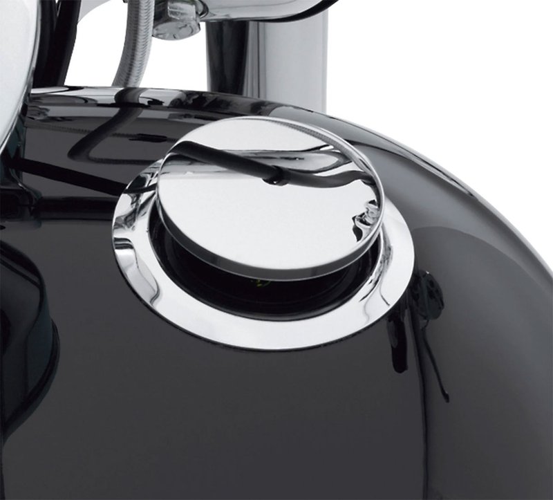 Harley-Davidson Accessories Emphasise the long, lean look of the fuel tank. This flush mount fuel cap and gauge kit offers a pop-up filler design that, when installed and sealed, looks identical to the flush gauge; a simple push and the filler cap pops up to provide ample grip, even while wearing gloves. The flush fuel gauge features individual LED lamps that shine through a mirror-coated glass which glows when the ignition is switched on. A photocell automatically adjusts LED brightness for improved visibility in direct sunlight, and dims at night to avoid distraction. The complete kit includes a fuel cap, fuel gauge, trim ring and plug-in wiring harness. Chrome finish.
