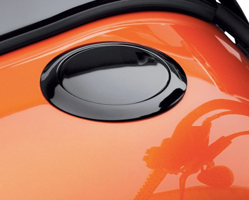 Harley-Davidson Accessories Emphasise the long, lean look of the fuel tank with this original Harley-Davidson flush mount fuel cap. The kit offers a pop-up filler design that replaces the original equipment twist-on fuel cap; a simple push and the filler cap pops up to provide ample grip, even while wearing gloves. Easy to install, the cap assembly screws into position and the self-adhesive decorative ring finishes the look. The complete kit includes a screw-in mount, pop-up cap and matching trim ring.