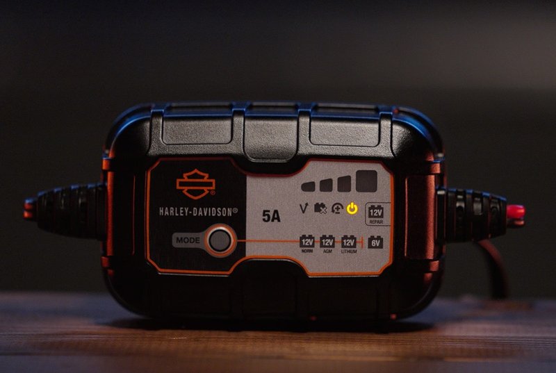 Harley-Davidson Accessories Avoid the dead battery blues with a new Harley-Davidson Dual-Mode Battery Charger. Ideal for today's popular motorcycle battery technologies, this charger can automatically charge and maintain Harley-Davidson Lithium LiFe or AGM Lead-Acid batteries, and just about any other battery in your home shop. It will effortlessly charge multiple battery voltages (6 and 12 volt) with chemistries such as flooded, gel, AGM and Lithium. You can also charge different types of batteries such as deep-cycle, marine, powersport and more. The charger is completely automatic. You can leave it plugged in 24/7 with no worries of overcharging, and no technical knowledge is required. Designed for use in any climate, it alters each charge based on the ambient temperature for a more accurate recharge. This fully-automatic charger is ideal for short- or long-term motorcycle battery charging needs. - For use within Europe and the Middle East - Selectable charge options provide optimal charging for Harley-Davidson Lithium LiFe or AGM Lead-Acid batteries - Can be used to charge 12 volt and 6 volt batteries - Can be used with existing Harley-Davidson battery charging cords - no additional charging cords needed - Features repair mode for AGM batteries - Maximum charge rate of 5.0 amp - Harley-Davidson tested and validated - Backed by a 5-year limited warranty
