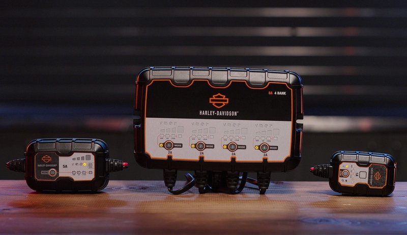Harley-Davidson Accessories Keep all your bikes fully charged and ready to ride. This fully-automatic 4-bank Harley-Davidson Dual-Mode Battery Charger is perfect for short- or long-term motorcycle battery charging needs. - 4-bank charging station can charge and maintain up to 4 batteries at once - Selectable charge options provide optimal charging for Harley-Davidson Lithium LiFe or AGM Lead-Acid batteries - Can be used to charge 12 volt and 6 volt batteries - Can be used with existing Harley-Davidson battery charging cords - no additional charging cords needed - Maximum charge rate of 2 amp - Harley-Davidson tested and validated