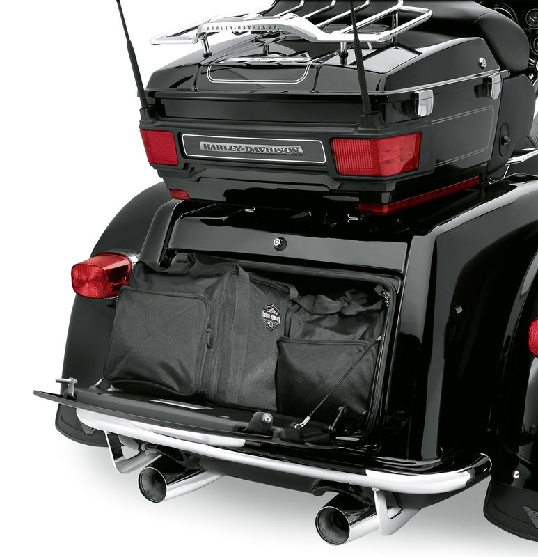Harley-Davidson Accessories Trunk Travel-Paks. These well-constructed ballistic nylon bags are designed to fit perfectly into the trunk of the Trike model. Styled with a reflective Bar & Shield logo, they feature zippered outer pouches and a mesh inner storage pocket for packing convenience, and comfortable carrying straps make transport easy. Sold in pairs. Fits '09-later Trike models.