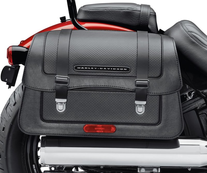 Harley-Davidson Accessories Detachables Saddlebag, black vinyl. Sized for the commute to work or a ride across the country, these modern waterfall-style bags complement the stripped-down look of the Softail cruiser models. They are completely removable with a simple pull of the internal handle and a rearward slide, leaving the bike unencumbered, and when removed they leave behind simple, inconspicuous docking points. Features a flip-back lid, a reinforced vinyl-wrapped body with perforated-style panels, a nickel/silver finish with nickel snap-to-close hardware, and a black chrome Harley-Davidson signature medallion. Complements stock and many accessory seats, and can be installed with HoldFast sissy bars and racks when equipped with model-specific docking hardware. Includes all required mounting hardware. Luggage capacity: 2,170 cubic inches. Fits Softail Slim FLSL, Street Bob FXBB/S, Standard FXST and Low Rider FXLR '18-later models.