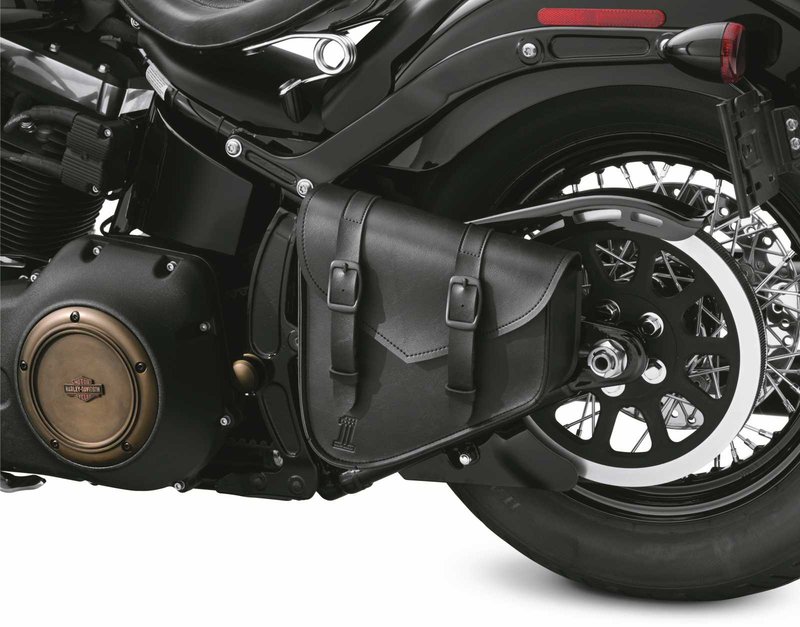 Harley-Davidson Accessories Black Standard Luggage Swingarm Bag. The Black Standard Collection bags have a simple black-on-black style that complements many styling directions and budgets. Made of ultra-durable leather-like synthetic with a debossed H-D #1 logo, an internal reinforcement system helps the bag hold its shape over time. The MOLLE-style system of mounting loops accommodates hook-and-loop straps for multiple mounting locations and orientations, with straight and perpendicular loops for versatile, easy mounting. It closes with either matte black enamel buckles with hidden quick-detach snaps or a hook-and-loop flap, and is great for storing a small set of tools or extra layers of riding gear. Luggage capacity: 250 cubic inches. Carrying capacity: 5 lbs. Fits Softail '00-'17 models (except FLSTC, FLSTNSE, FLSTSE, FXCW and FXCWC).
