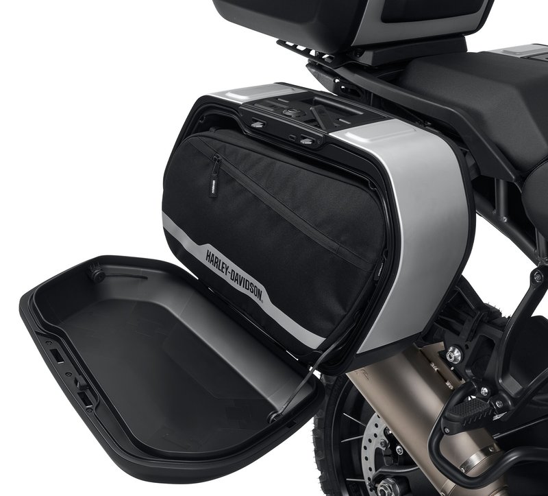 Harley-Davidson Accessories Simplify packing and unpacking your motorcycle. These liners are designed to fit perfectly into the Sport Side Cases. Styled with a Bar & Shield logo, they feature heavy-duty zips, comfortable carrying handles and convenient D-rings for optional shoulder straps. - Prevents loose items from falling out of the side cases when the lid is opened - Carrying handles have an integrated hook-and-loop patch to keep them together - Shoulder strap allows easy hands-free transport - Includes two side case liners