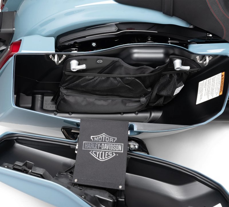 Harley-Davidson Accessories Saddlebag Wall Organizer. This convenient storage system equips the interior wall of your colour-matched saddlebags for easy access to keys, phones, maps and gloves. The organiser features a combination of mesh and enclosed pouches and pockets sized for safe, rattle-free packing. Its rigid backing attaches easily to the saddlebag wall using the Original Equipment quick-release fasteners, and it is shaped to follow the contour of the interior to maximise storage space. The kit includes left- and right-hand organisers. Fits Street Glide and Road Glide '24-later, and FLHXSE and FLTRXSE (CVO) '23-later models.