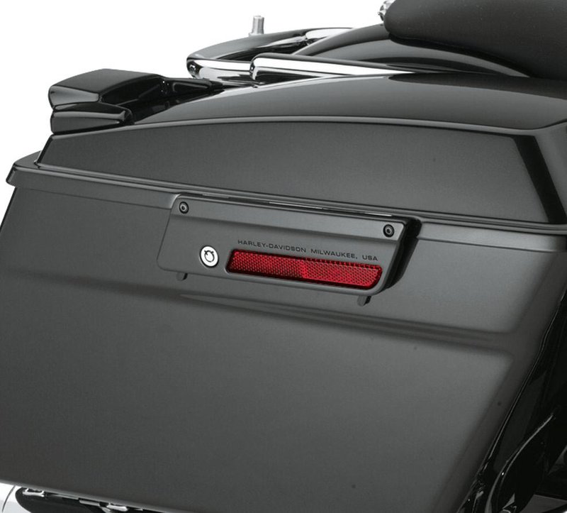 Harley-Davidson Accessories Saddlebag Latch Plate, left, Vivid Black. Colour-matched saddlebag latch plates are an easy way to give your Touring bike a unique monochrome look. Available in Vivid Black or Primed finish, these latches add a splash of colour to the motorcycle profile and install easily with Original Equipment hardware. Fits '93-later Touring models equipped with colour-matched hard saddlebags.