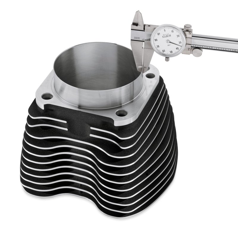 Harley-Davidson Accessories When it comes to increasing engine power, there is no substitute for more cubic inches. With efficient filling of the air/fuel mixture, the bigger the displacement, the more power your engine can produce. In the past, the only way to increase the bore of your 96 or 103 cubic inch Twin Cam V-Twin motor was to tear down the motor and re-bore the engine cases to fit larger bore cylinder spigots. It was a labor-intensive and expensive process. Now, you can take your 96 or 103 cubic inch motor to a full 110 cubic inches without removing the engine from the chassis. The Screamin' Eagle team has engineered a 4" Big Bore Cylinder and Piston package that increase the internal bore from 3-7/8" to 4", without increasing the outside diameter of the cylinder spigot. The cylinder slips into the existing case bore without modification. This kit will add a whopping 7 cubic inches of displacement for more torque throughout the RPM range. The kit includes front and rear cylinders, system-matched pistons with rings and breathers.