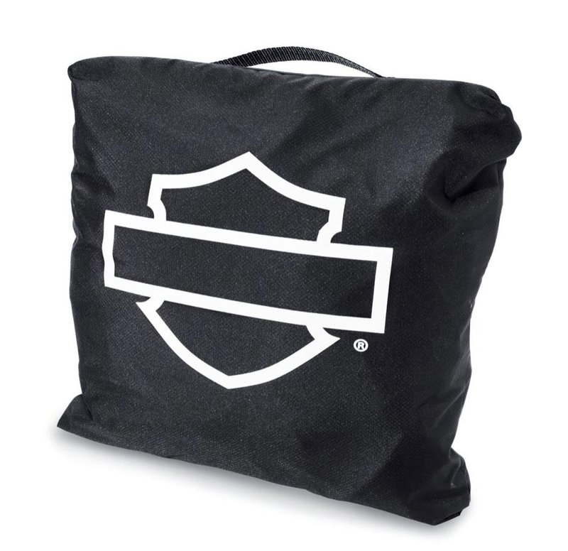 Harley-Davidson Accessories Protect your bike from dust and scratches. Perfect for a bike that's parked indoors, this breathable polyester cover promotes air circulation to reduce moisture build-up and minimize corrosion during short or long term storage. - Cover skirt features front and rear adjustable drawstrings to cinch the cover around the bike, and a convenient belly strap to reduce ballooning in the wind - The corset-style cinching system along the backbone lets you adjust the cover for best fit on a variety of models, and the hook-and-loop opening at the rear accommodates antennas - The two-tone orange and black cover features reflective piping for added visibility, and an integrated storage pouch for convenient packing when not in use