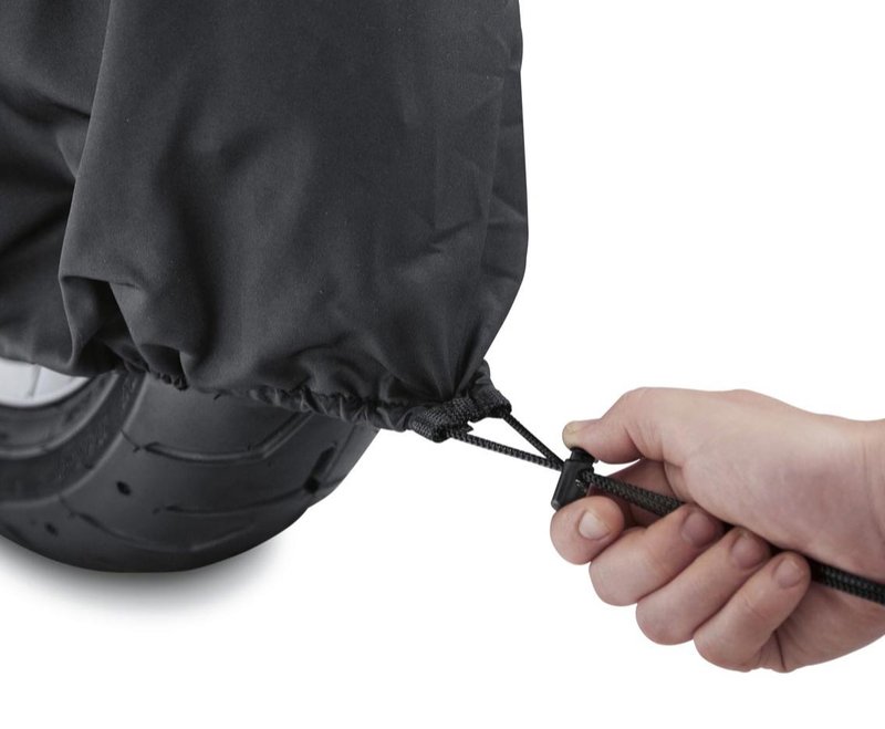 Harley-Davidson Accessories Protect your bike from dust and scratches. Perfect for a bike that's parked indoors, this breathable polyester cover promotes air circulation to reduce moisture build-up and minimize corrosion during short or long term storage. - Cover skirt features front and rear adjustable drawstrings to cinch the cover around the bike, and a convenient belly strap to reduce ballooning in the wind - The corset-style cinching system along the backbone lets you adjust the cover for best fit on a variety of models, and the hook-and-loop opening at the rear accommodates antennas - The two-tone orange and black cover features reflective piping for added visibility, and an integrated storage pouch for convenient packing when not in use