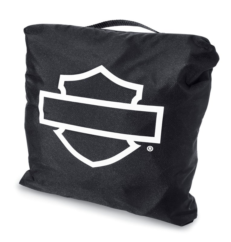 Harley-Davidson Accessories Pamper your bike. This luxuriously soft microfiber cover is ideal for short and long term indoor storage. - The breathable microfiber material promotes air circulation to reduce moisture build-up and minimize corrosion - Cover skirt features front and rear adjustable drawstrings to cinch the cover around the bike, and a convenient belly strap to reduce ballooning in the wind - The corset-style cinching system along the backbone lets you adjust the cover for best fit on a variety of models - The cover features heat-resistant panels that protect the material from warm exhaust, and the hook-and-loop opening at the rear of Touring covers accommodates antennas - The two-tone orange and black cover features reflective piping for added visibility, and an integrated storage pouch for convenient packing when not in use