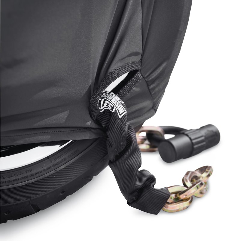 Harley-Davidson Accessories Pamper your bike. This luxuriously soft microfiber cover is ideal for short and long term indoor storage. - The breathable microfiber material promotes air circulation to reduce moisture build-up and minimize corrosion - Cover skirt features front and rear adjustable drawstrings to cinch the cover around the bike, and a convenient belly strap to reduce ballooning in the wind - The corset-style cinching system along the backbone lets you adjust the cover for best fit on a variety of models - The cover features heat-resistant panels that protect the material from warm exhaust, and the hook-and-loop opening at the rear of Touring covers accommodates antennas - The two-tone orange and black cover features reflective piping for added visibility, and an integrated storage pouch for convenient packing when not in use