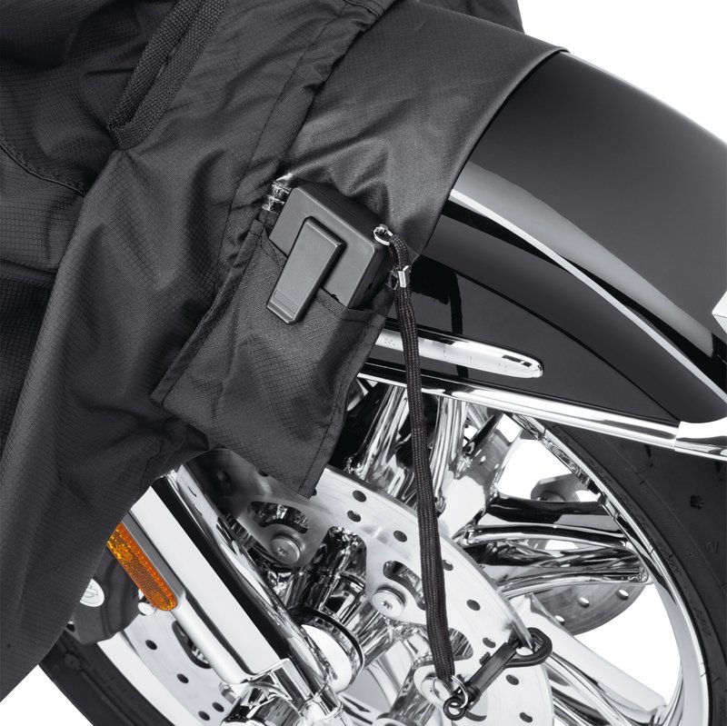 Harley-Davidson Accessories Pamper your bike. This luxuriously soft microfiber cover is ideal for short and long term indoor storage. - The breathable microfiber material promotes air circulation to reduce moisture build-up and minimize corrosion - Cover skirt features front and rear adjustable drawstrings to cinch the cover around the bike, and a convenient belly strap to reduce ballooning in the wind - The corset-style cinching system along the backbone lets you adjust the cover for best fit on a variety of models - The cover features heat-resistant panels that protect the material from warm exhaust, and the hook-and-loop opening at the rear of Touring covers accommodates antennas - The two-tone orange and black cover features reflective piping for added visibility, and an integrated storage pouch for convenient packing when not in use