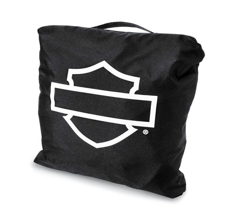 Harley-Davidson Accessories Guard your bike from Mother Nature. Perfect for a bike that is exposed to the elements, this heavy duty cover is manufactured from diamond-pattern 300 Denier fade-resistant polyester and features taped seams for water resistance. - The weather-shielded vents in the top of the cover promote air circulation to reduce moisture build-up and minimize corrosion during short or long term storage - Internal heat-resistant panels protect the cover from warm exhaust and an integrated storage pouch permits convenient packing when not in use - The cover skirt features front and rear adjustable drawstrings to cinch the cover around the bike, and a convenient belly strap to reduce ballooning in the wind - The corset-style cinching system along the backbone lets you adjust the cover for best fit on a variety of models, and the hook-and-loop opening on Touring covers accommodates antennas - Available in your choice of two-tone orange and black or inconspicuous plain black finish, the cover features reflective piping for added visibility