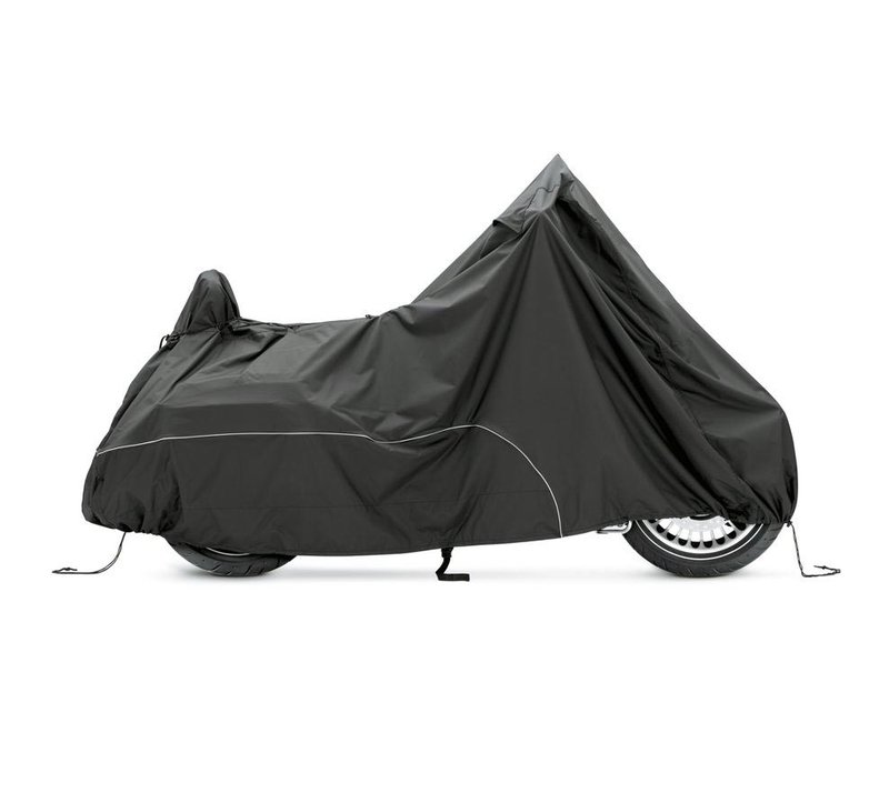 Harley-Davidson Accessories Guard your bike from Mother Nature. Perfect for a bike that is exposed to the elements, this heavy duty cover is manufactured from diamond-pattern 300 Denier fade-resistant polyester and features taped seams for water resistance. - The weather-shielded vents in the top of the cover promote air circulation to reduce moisture build-up and minimize corrosion during short or long term storage - Internal heat-resistant panels protect the cover from warm exhaust and an integrated storage pouch permits convenient packing when not in use - The cover skirt features front and rear adjustable drawstrings to cinch the cover around the bike, and a convenient belly strap to reduce ballooning in the wind - The corset-style cinching system along the backbone lets you adjust the cover for best fit on a variety of models, and the hook-and-loop opening on Touring covers accommodates antennas - Available in your choice of two-tone orange and black or inconspicuous plain black finish, the cover features reflective piping for added visibility