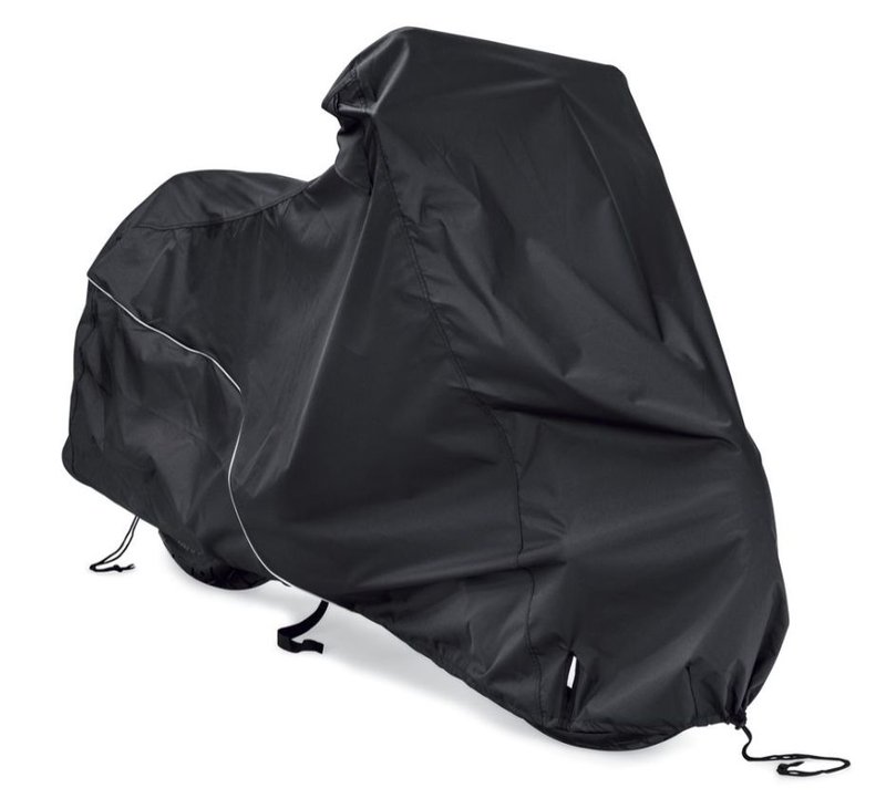 Harley-Davidson Accessories Now available in a compact size to fit Harley-Davidson Street and Sportster models, this cover guards your bike from Mother Nature. Perfect for a bike that is exposed to the elements, this heavy duty cover is manufactured from diamond-pattern 300 Denier fade-resistant polyester and features taped seams for water resistance. - Black, for indoor/outdoor use - Weather-shielded vents in the top of the cover promote air circulation to reduce moisture build-up and minimize corrosion during short or long term storage - Internal heat-resistant panels protect the cover from warm exhaust and an integrated storage pouch permits convenient packing when not in use - Cover skirt features front and rear adjustable drawstrings to cinch the cover around the bike and a convenient belly strap to reduce ballooning in the wind - Features a convenient opening near the front wheel for a security chain or cable - Features reflective piping for added visibility