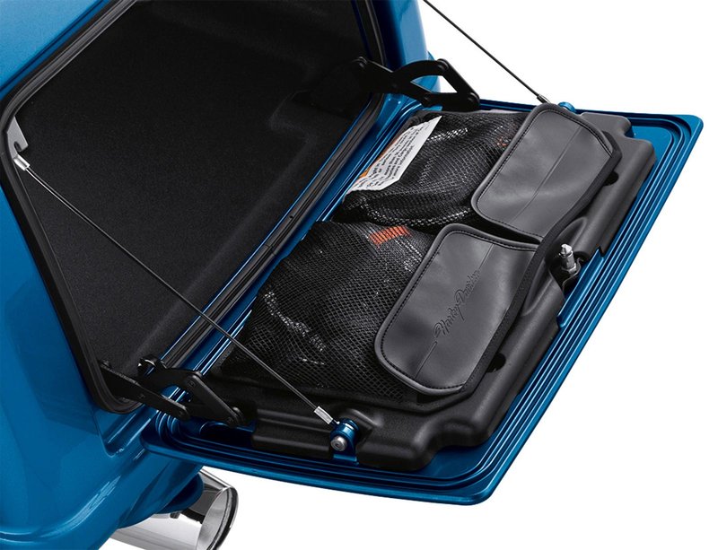 Harley-Davidson Accessories Trike Trunk Door Organizer. For on-the-road storage and efficiency, this organiser keeps smaller items conveniently located on your trunk door for easy access. The easy-to-install self-adhesive organiser features two large nylon-mesh pockets with hook-and-loop-secured flaps for quick access to keys, phones, glasses, gloves and maps, and is finished with an embossed "Harley-Davidson" script logo. Fits FLHTCUTG Trike '09-later models.