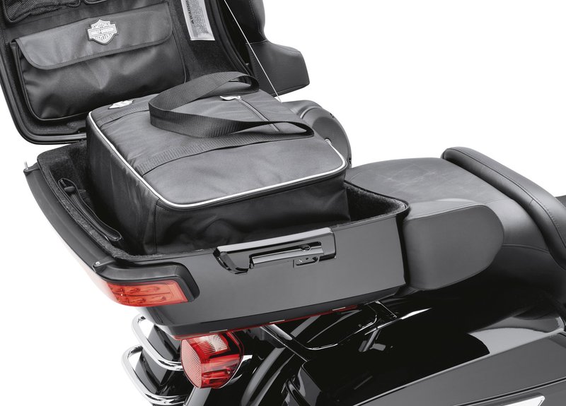 Harley-Davidson Accessories Premium Travel-Pak. These bags are made of water-resistant ballistic nylon that matches the premium luggage collection. The exterior features comfortable carrying handles, heavy-duty glove-friendly zippers, a zippered pocket, D-rings for optional carrying straps, and 3M Scotchlite reflective trim. The padded interior offers a variety of convenient storage pockets plus plenty of open storage. Fits Touring '14-later models equipped with King Tour-Pak luggage.