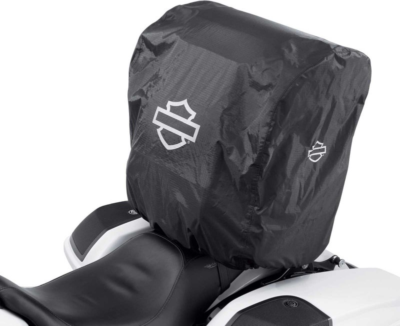 Harley-Davidson Accessories Onyx Premium Touring Bag. Part of the Onyx Premium Luggage Collection, this Touring Bag is built for long-haul trips. It features a separate top compartment to keep your shoes apart from your clothes, a main compartment large enough for two weeks of jeans and t-shirts, and removable lid straps that stop the top compartment falling forward or back when loading. The large front pocket holds keys, pens, documents and small electronics, two upper outer pockets suit eyewear, and two large lower exterior pockets are ideal for rain gear. Made of premium 1680-denier UV-stable ballistic polyester that stands up to tough road and weather conditions without fading. Features water-resistant zippers with glove-friendly pulls, a burnt-orange interior for easy visibility, MOLLE-style webbing for modular pouch attachment, a non-slip abrasion-resistant base and reflective piping. Dimensions: 19.2" W x 12.7" D x 20.5" T. Capacity: 3,500 cubic inches (57 litres). Includes a removable shoulder strap and a rain cover with an elastic hem and barrel-lock mechanism that stays put at highway speeds.