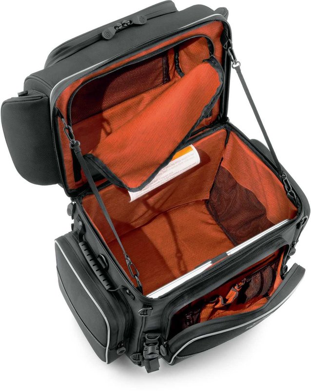 Harley-Davidson Accessories Onyx Premium Touring Bag. Part of the Onyx Premium Luggage Collection, this Touring Bag is built for long-haul trips. It features a separate top compartment to keep your shoes apart from your clothes, a main compartment large enough for two weeks of jeans and t-shirts, and removable lid straps that stop the top compartment falling forward or back when loading. The large front pocket holds keys, pens, documents and small electronics, two upper outer pockets suit eyewear, and two large lower exterior pockets are ideal for rain gear. Made of premium 1680-denier UV-stable ballistic polyester that stands up to tough road and weather conditions without fading. Features water-resistant zippers with glove-friendly pulls, a burnt-orange interior for easy visibility, MOLLE-style webbing for modular pouch attachment, a non-slip abrasion-resistant base and reflective piping. Dimensions: 19.2" W x 12.7" D x 20.5" T. Capacity: 3,500 cubic inches (57 litres). Includes a removable shoulder strap and a rain cover with an elastic hem and barrel-lock mechanism that stays put at highway speeds.