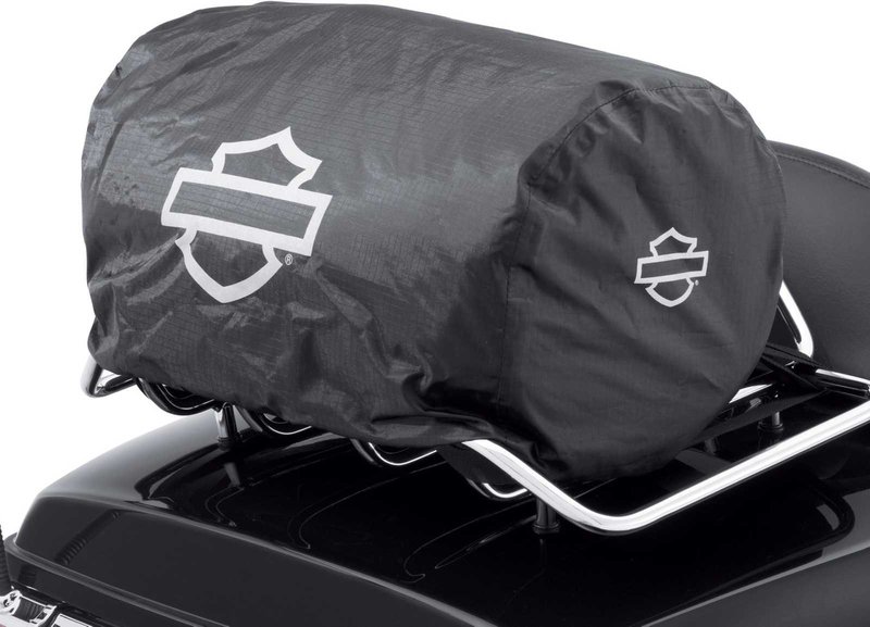 Harley-Davidson Accessories Onyx Premium Luggage Day Bag. Part of the Onyx Premium Luggage Collection, this compact Day Bag is ideal for the daily commute or a short day trip. The main compartment holds a sweatshirt, a pair of shoes, a rainsuit, gloves and a cap, while an interior mesh zip pocket keeps keys or small electronics handy. Its rigid structure keeps its shape even when empty, and the detachable padded shoulder strap makes it easy to carry. Made of premium 1680-denier UV-stable ballistic polyester that stands up to tough road and weather conditions without fading. Features water-resistant zippers with glove-friendly pulls, a burnt-orange interior for easy visibility, MOLLE-style webbing for modular pouch attachment, a non-slip abrasion-resistant base and reflective piping. Dimensions: 16.75" W x 9" D x 9" T. Capacity: 1,000 cubic inches (16 litres). Includes a removable shoulder strap and a rain cover with an elastic hem and barrel-lock mechanism that stays put at highway speeds. Fits models equipped with luggage racks (with or without a sissy bar upright) and Tour-Pak luggage racks (except Mini Rack P/N 53100-95).