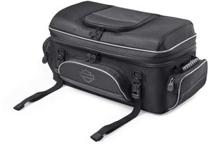 Harley-Davidson Accessories Onyx Premium Luggage Tour-Pak Rack Bag. Part of the Onyx Premium Luggage Collection, this bag is designed to sit atop most Tour-Pak luggage racks, adding storage for long trips. The main compartment features three mesh pockets for organisation and enough space for clothes on a short trip. Outside, the top zip pocket is fleece-lined for protective eyewear storage, while the front, back and side pockets suit gloves, keys, cords and a phone charger. Dual side-carry handles, a rubber top handle and a detachable shoulder strap make off-bike transport easy, and rigid construction keeps the bag in shape even when empty. Made of premium 1680-denier UV-stable ballistic polyester that stands up to tough road and weather conditions without fading. Features water-resistant zippers with glove-friendly pulls, a burnt-orange interior for easy visibility, MOLLE-style webbing for modular pouch attachment, a non-slip abrasion-resistant base and reflective piping. Dimensions: 24" W x 14" D x 10.4" T. Capacity: 2,600 cubic inches (42 litres). Includes a removable shoulder strap and a rain cover with an elastic hem and barrel-lock mechanism that stays put at highway speeds. Fits models equipped with Tour-Pak luggage racks (except FLRT and FLHXXX, or Mini Rack P/N 53100-96).
