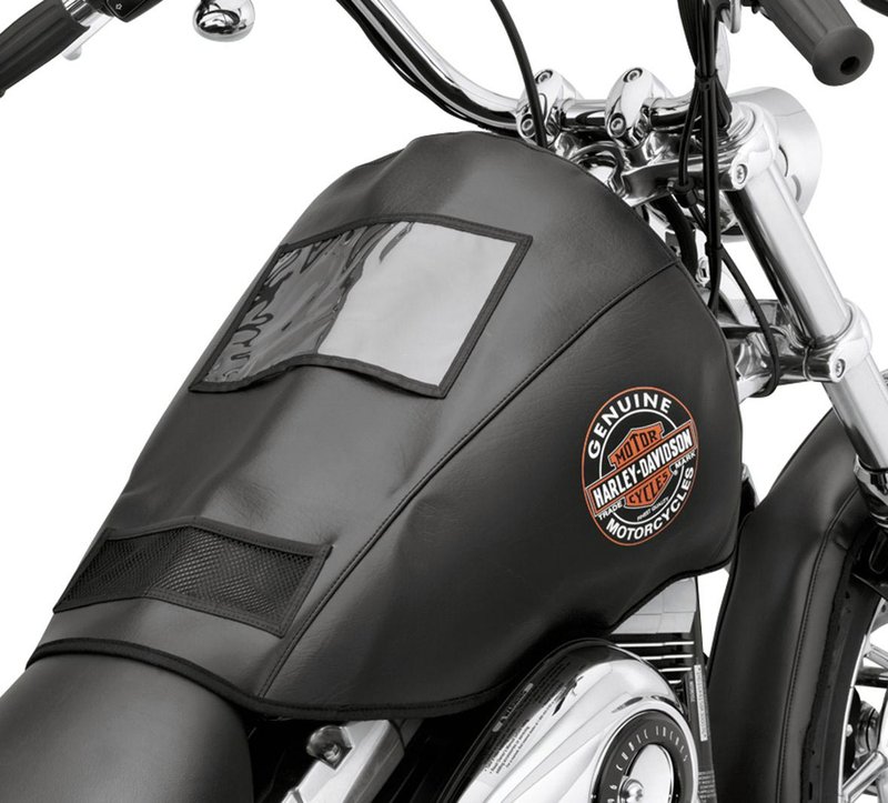 Harley-Davidson Accessories Protect the finish on your tank and fenders while performing routine service on your motorcycle. These custom shaped covers feature an easy-to-clean black vinyl outer surface and a soft non-abrasive fleece inner liner. - Fuel tank covers feature built-in magnets to prevent the cover from sliding, convenient mesh pockets to keep small parts from rolling away, and a clear paperwork window for notes and instruction sheets - Fender covers feature soft elastic bands to keep the covers firmly in place - To complete the look, the cover features a nostalgic Harley-Davidson logo that will look great in any garage