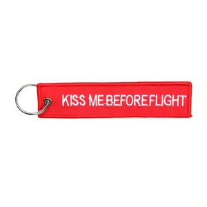 Army Surplus Kiss Me Before Flight keychain red