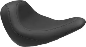 Mustang Wide Tripper™ Seat<br><ul><li>High-quality expanded vinyl cover combines the appearance of leather with the durability to withstand the elements</li><li>Matching passenger seat offers a spacious 10” width for passengers and is 2.5” wider than stock passenger area</li><li>Sits the rider slightly lower but at a similar reach to controls compared to stock</li><li>Cut narrow at the nose so the rider can easily plant their feet on the ground</li></ul>