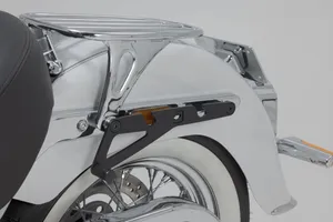 SW-Motech SLH Side Carrier<br><ul><li>The bike-specific bag carrier can be easily and quickly mounted on to original attachment points on the fender strut</li><li>The quick lock system allows LH Legend Gear side bags to be attached and removed in just a few easy hand movements, without the driver foregoing reliable bag fastening</li><li>Developed for Harley-Davidson models</li><li>Use with Harley-Davidson original accessories (sissy bar, rack) possible</li><li> Stainless Steel</li></ul>
